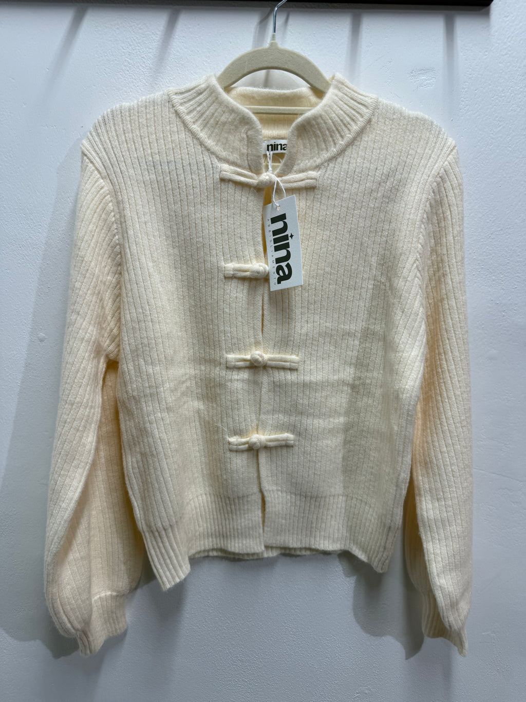 Cardigan con bottoni a rana